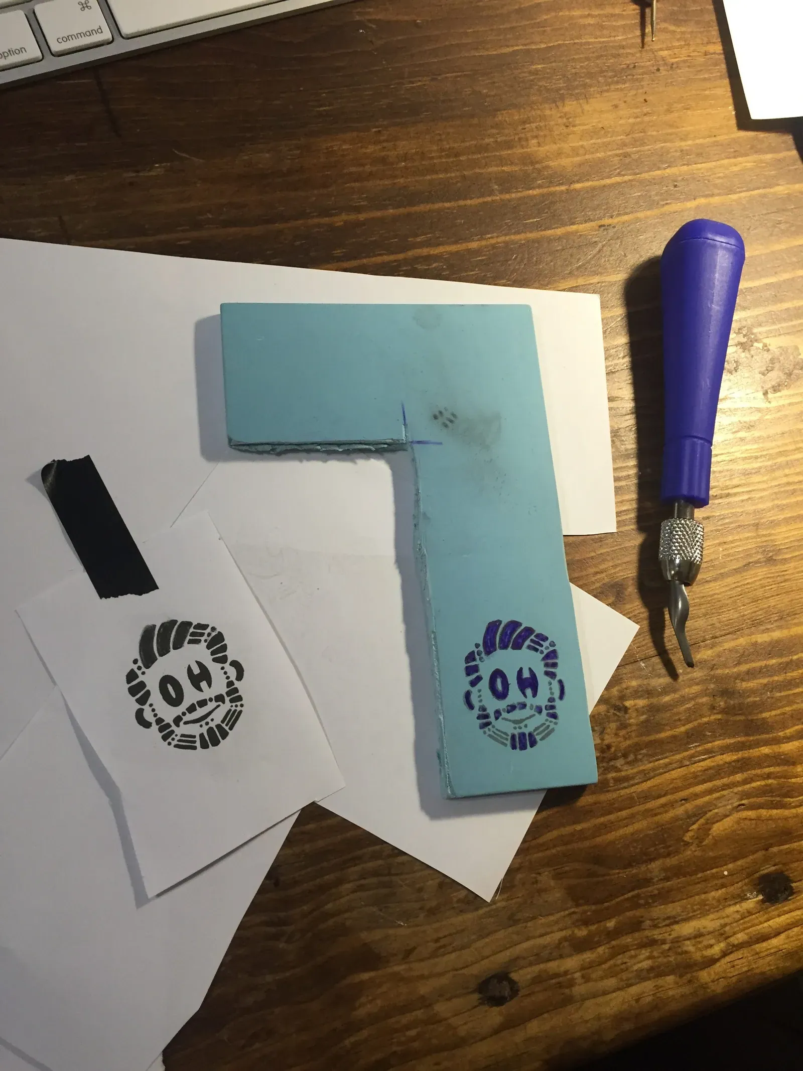 stamp carving of happy Oscar logo